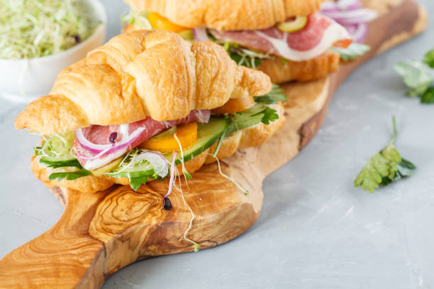istock croissant sandwich with ham, olives and vegetable 843752942