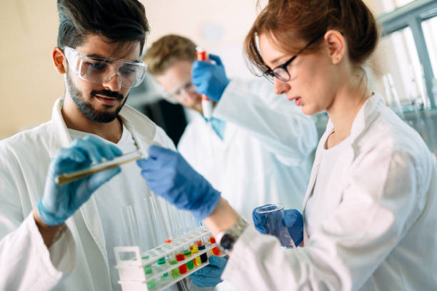 istock Young students of chemistry working in laboratory 843762934