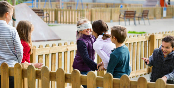 istock Laughing children playing at Blind man bluff 843763100