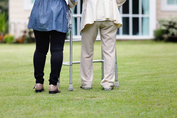 istock Elderly woman exercise walking in backyard with daughter 843764276
