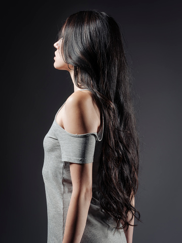 A young woman with very long black hair.