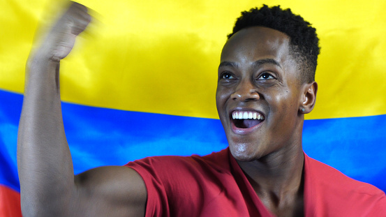 Colombian Young Black Man Celebrating with Colombia Flag