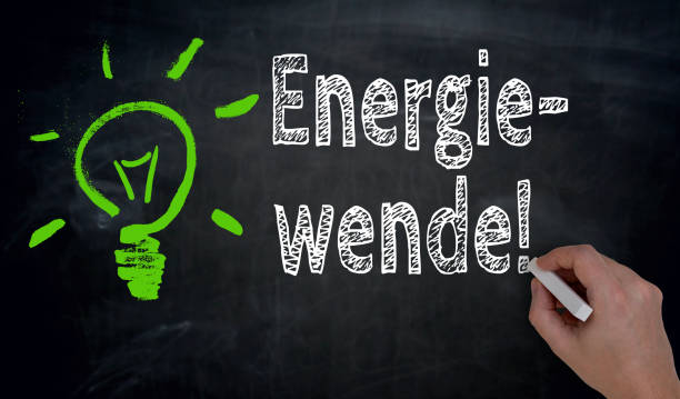 Energiewende (in german green Energy) is written by hand on blackboard stock photo