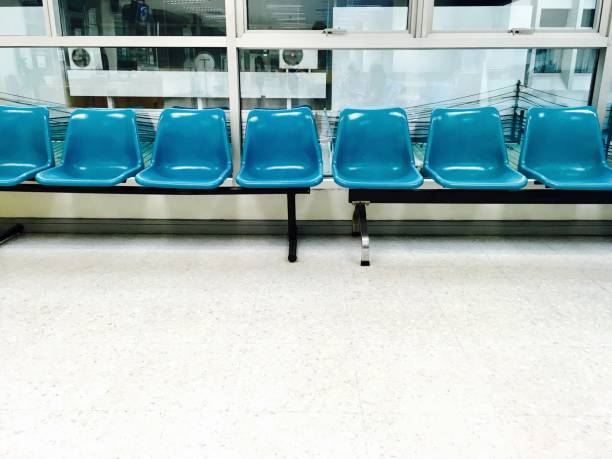 istock Row of Empty Chairs in Waiting Room 843768578