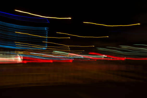 istock Colored lights in motion at night as abstract background 843768916