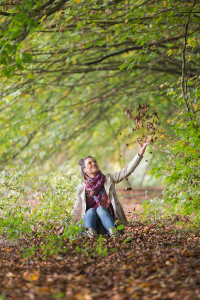 istock Women at autumn in the Forest 843771582