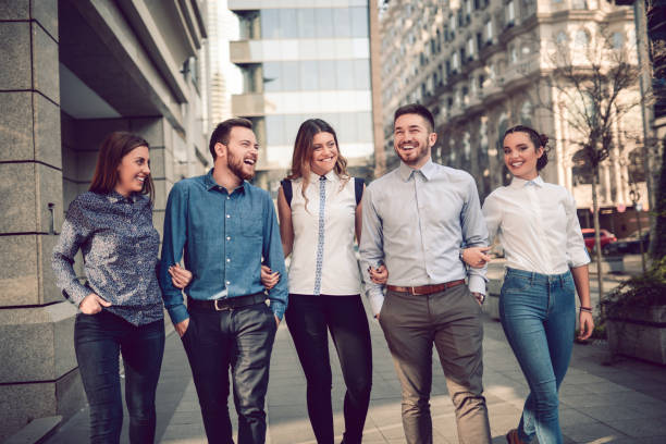 istock Smiling Young Students Walking on the Street and Talking 843771684