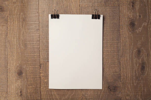 istock Poster mock up template over wooden wall background 843774960