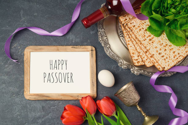 istock Passover holiday concept seder plate, matzoh and photo frame on dark background. Top view from above 843775014