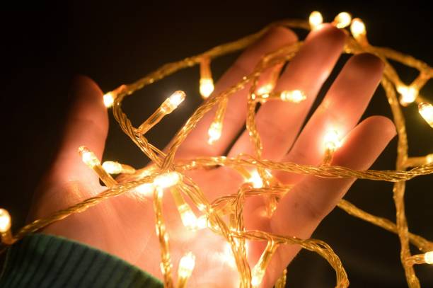 istock Christmas lights in the hands 843775632