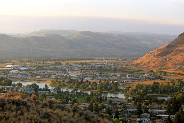 Evening Light On Kamloops Industrial Area And The Highway High angle view looking down to industrial area. #5 (Yellowhead Higway to right)  Thompson River winds through city. kamloops stock pictures, royalty-free photos & images