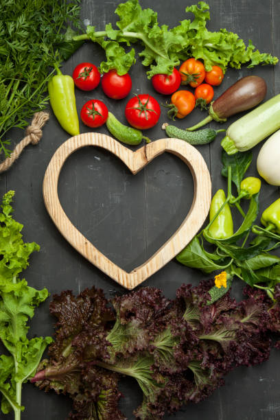 istock Raw vegetables on a black wooden background 843778460