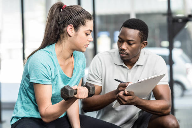 istock Trainer giving advice to woman 843782600