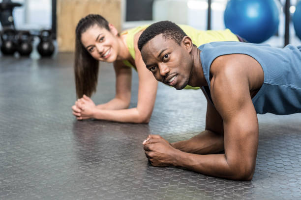 istock Athletic man and woman working out 843782646