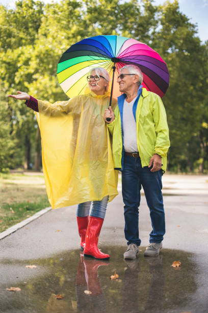 istock Couple with a rainbow umbrella 843785056