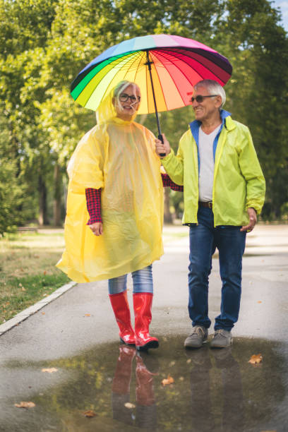 istock Couple with a rainbow umbrella 843786094