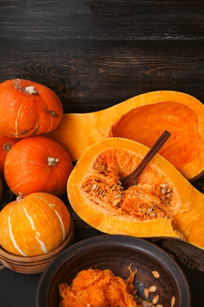 istock pumpkin with seeds on a wooden background 843793728