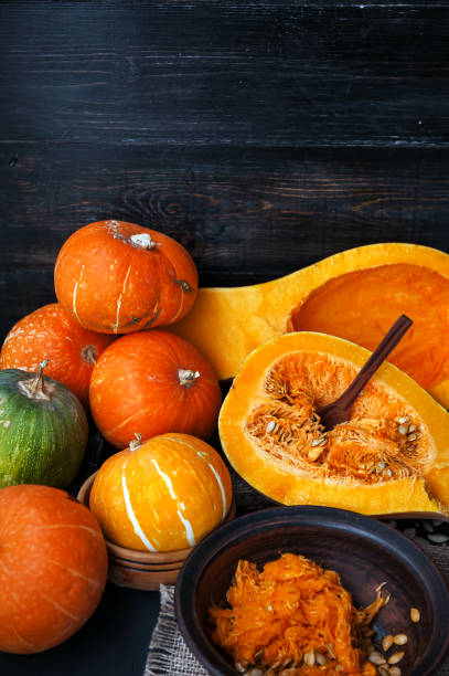 istock pumpkin with seeds on a wooden background 843793818