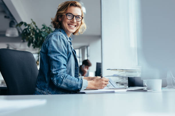 istock Female manager working at her desk 843794092
