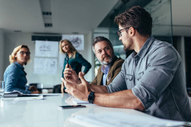 istock Businessman putting forward his suggestions to team 843794306