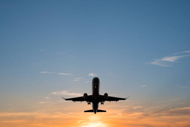 istock airplane on sunset sky , aircraft silhouette scenic sky 843794356