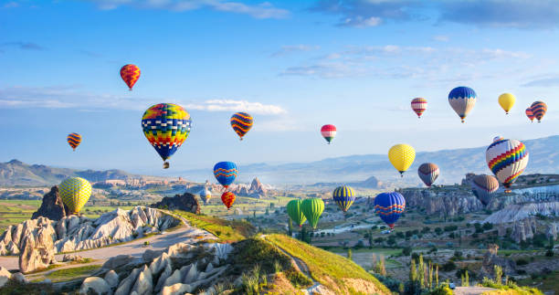 The great tourist attraction of Cappadocia - balloon flight. Cappadocia is known around the world as one of the best places to fly with hot air balloons. Goreme, Cappadocia, Turkey The great tourist attraction of Cappadocia - balloon flight. Cappadocia is known around the world as one of the best places to fly with hot air balloons. Goreme, Cappadocia, Turkey cappadocia photos stock pictures, royalty-free photos & images