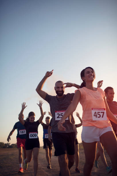istock Marathon Racers Throwing Holi Colors 843797184