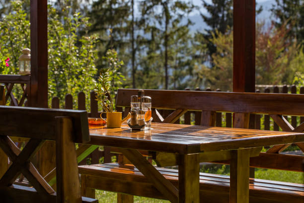 istock Wooden table with oliviera and flowers 843797376