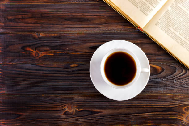 istock Cup of coffee on a wooden table 843800316