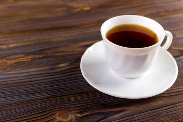istock Coffee cup top view on wooden table background 843800346