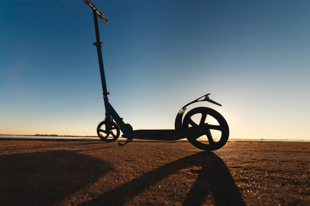istock Kick scooter on asphalt running track , under sunlight at sunny summer day 843810000