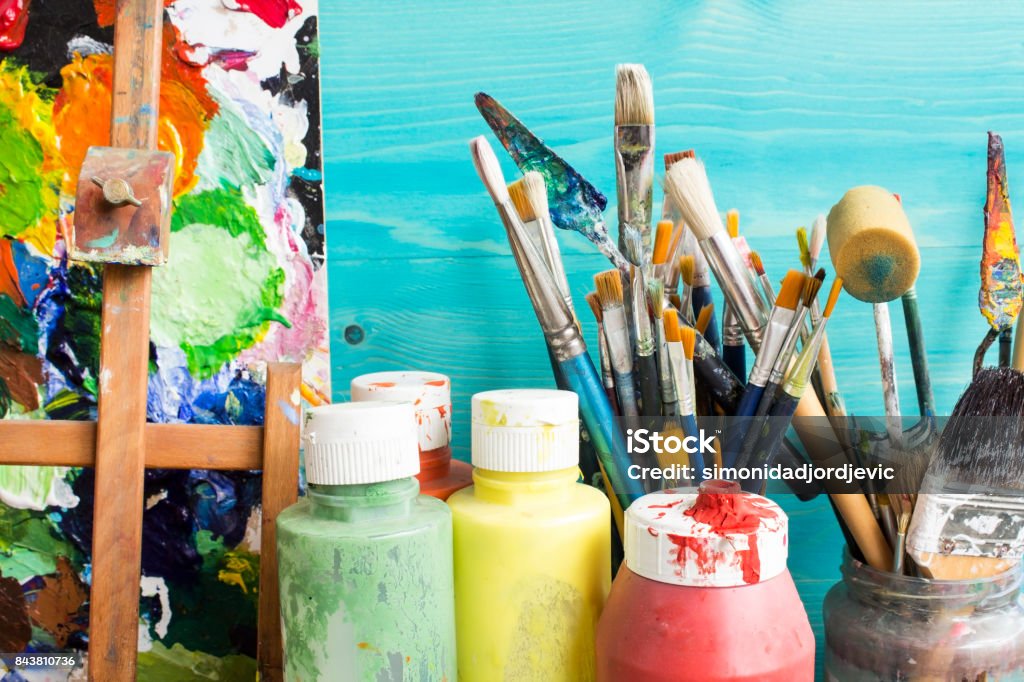 Painting Equipment Painting equipment, paint, brushes and  pallet. Art Studio Stock Photo