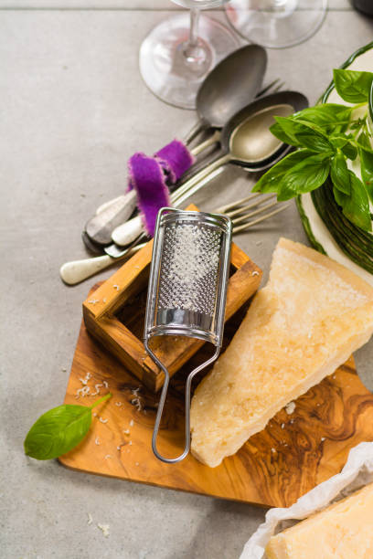Aged parmesan cheese on the olive wooden board