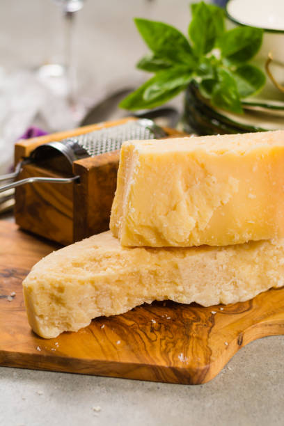 istock Aged parmesan cheese on the olive wooden board 843813774