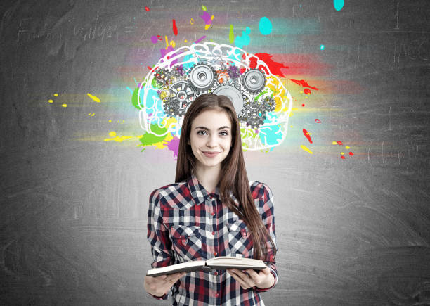 istock Pretty geek girl with a book and brain cogs 843814352