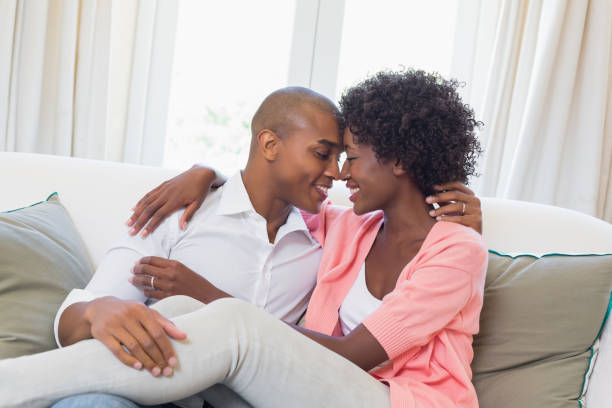 istock Happy couple relaxing on the couch 843819992