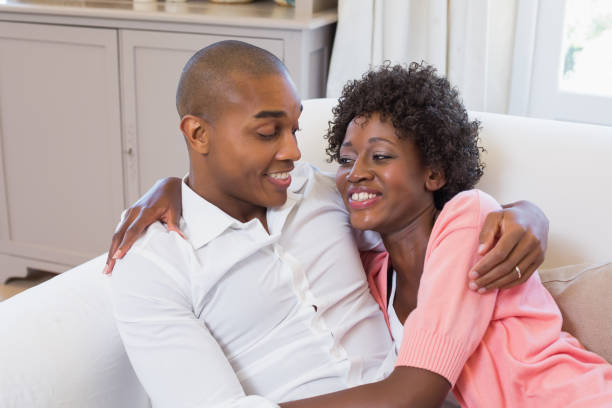 istock Cute couple relaxing on couch 843820130