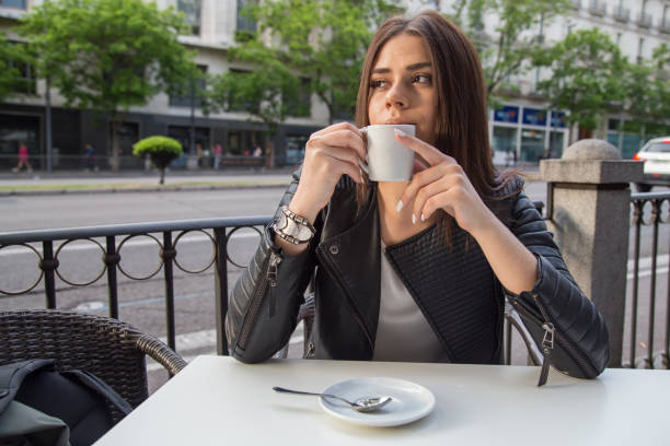 istock Woman having coffee on terrace 843820528