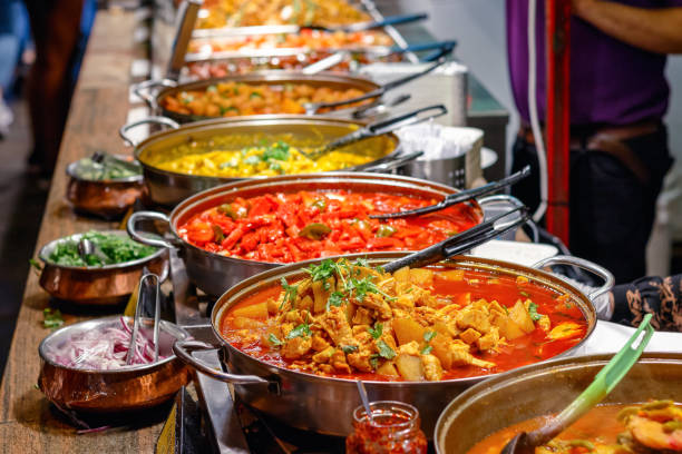 cooked curries on display at camden market in london - tradition culture imagens e fotografias de stock