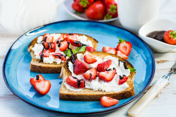 istock Snack from Wholemeal Bread Toasts, Ricotta cheese and Strawberri 843824528