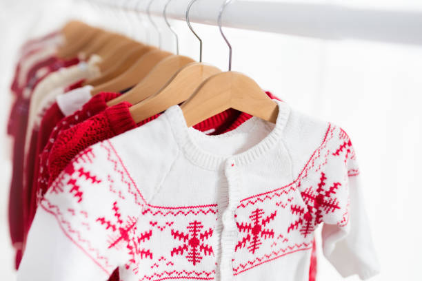 istock Clothes rack with red Christmas knit wear 843830398