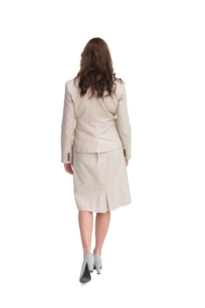 istock Classy businesswoman walking away from camera 843833164