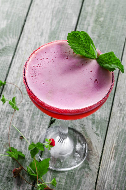 istock Glass of alcoholic raspberry and mint cocktail 843836366