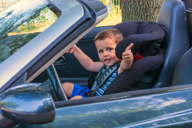 Child in a car child seat stock photo