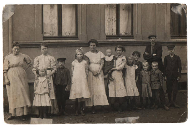Old family photo, parents with eleven children stock photo