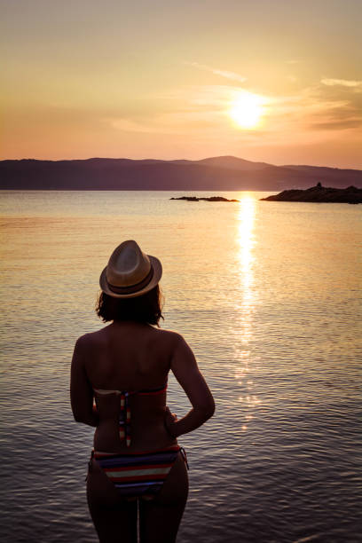 istock Girl watching the sunset 843843354