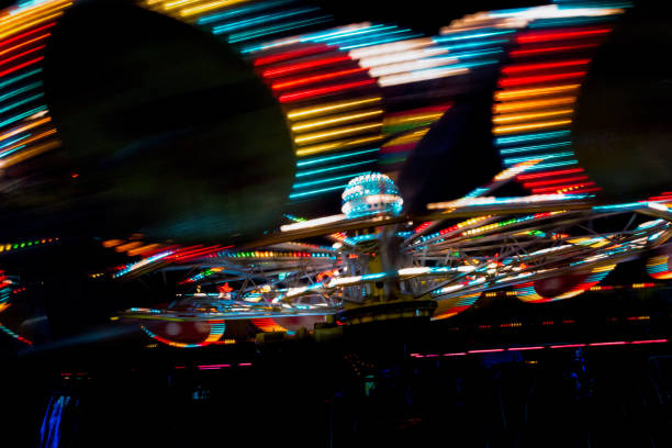 istock luna park attraction wheel  with lights in motion segment of circle 843846398