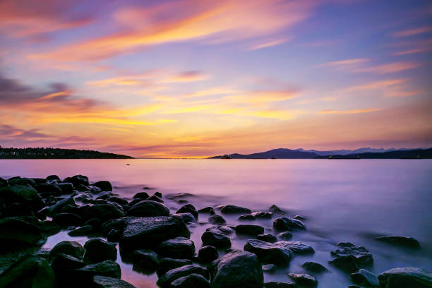 istock sea inlet sunset glow with smooth effect on water and clouds 843846736