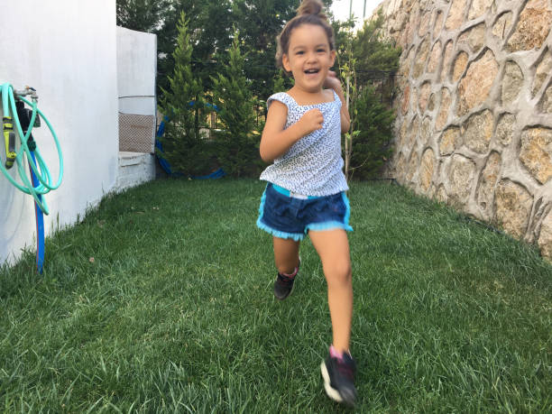 istock running child at the garden 843853538