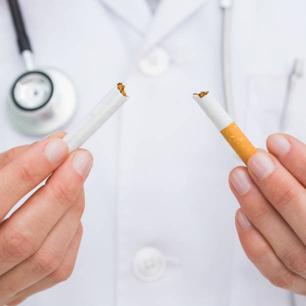 istock Close up on doctor breaking cigarette 843856818